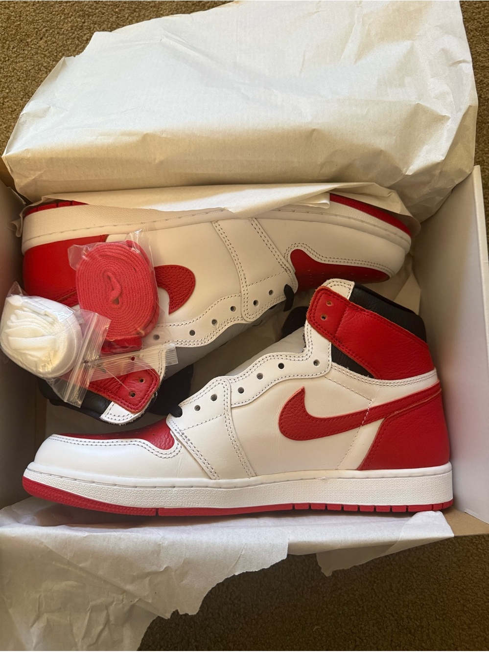 Jordan• 1 Retro High OG in White, University Red, Black
